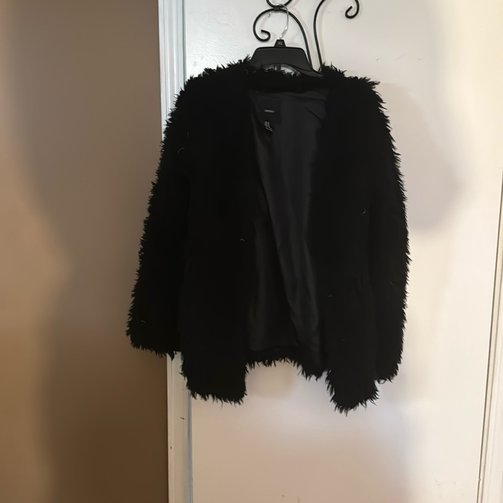 Open front black sweater.